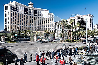 view of a busy street near the Belagio Hotel in Las Vegas with hotels and tourists on a sunny day. Nevada, USA Editorial Stock Photo