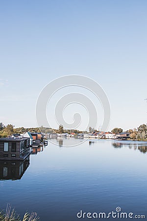 View of the canal and the outskirts of Amsterdam. Peaceful life next to busy life Stock Photo