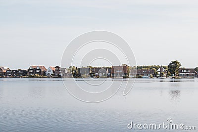 View of the canal and the outskirts of Amsterdam. Peaceful life next to busy life Stock Photo