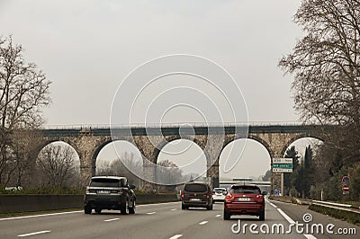 Arched overpass over the highway. Editorial Stock Photo