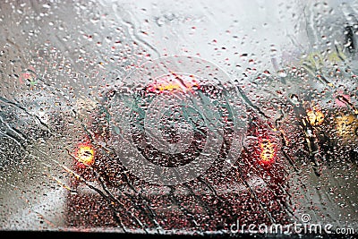 View from the car windscreen during rain and wet snow. Poor visibility while driving around the city. Stock Photo