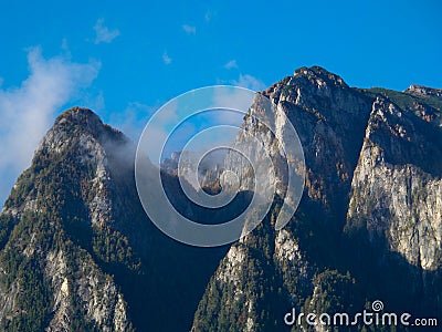 Caraiman mountain with some clouds Stock Photo