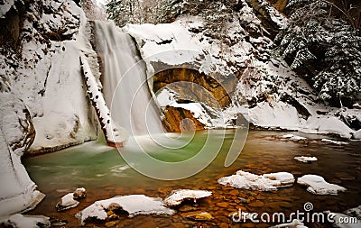 View of Casoca waterfall in winter, Buzau, Romania Stock Photo