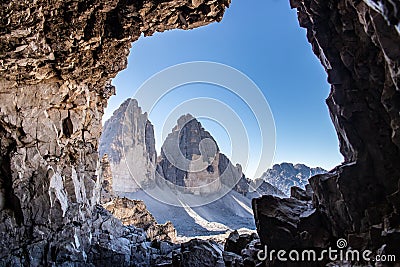 View from a cave on two of the three peaks / Tre Cime Stock Photo