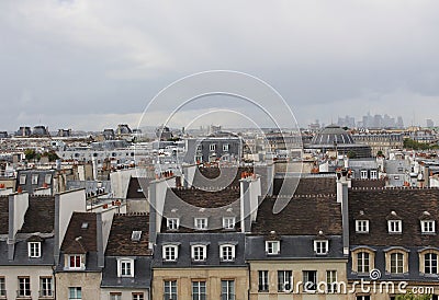 View of the centre streets of Paris. Roofs of Paris. Autumn dramatic sky. Stock Photo