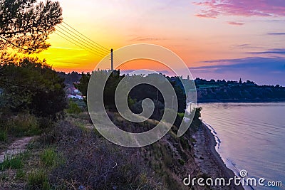 Colorful sunrise skies Chalkidiki beach at sunrise Aegean Sea Greece Stock Photo