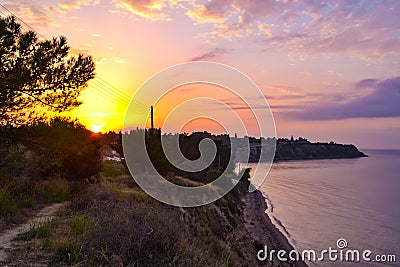 Dramatic sunrise skies Chalkidiki beach at sunrise Aegean Sea Greece Stock Photo