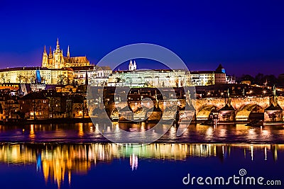 View of Charles Bridge, Prague Castle and Vltava river in Prague, Czech Republic during sunset time. World famous landmarks in Stock Photo