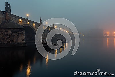 View of the Charles Bridge in Prague at the sunrise with mystical fog. Czech Republic Stock Photo