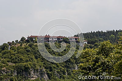 View of Cherven village, Bulgaria, located below, above and in the high limestone cliffs Stock Photo