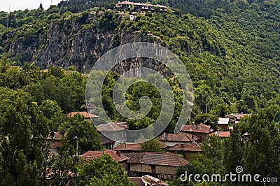 View of Cherven village, Bulgaria, located below, above and in the high limestone cliffs Stock Photo