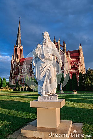 View of the Church of the Holy Trinity and the sculpture in front of it in Gervyaty, Grodno region, Belarus Editorial Stock Photo