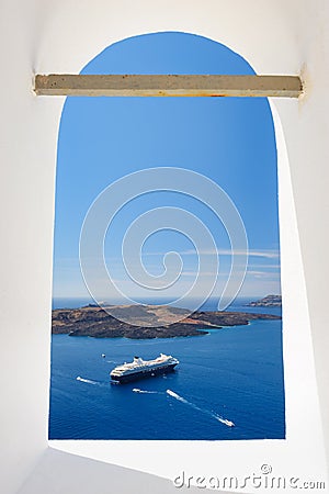 View through church window in Fira to caldera sea, Santorini Stock Photo