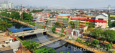 The view of Ciliwung River in Duri Kepa with Pelita School Building of West Jakarta Editorial Stock Photo
