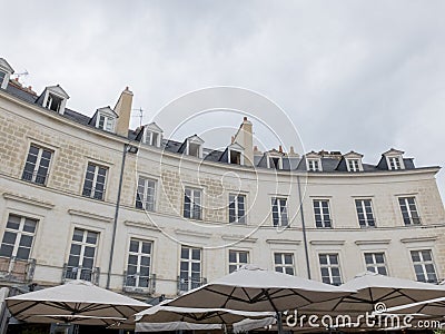 View of circular construction section in a square of characteristic Bretan country. Below you can see the bar umbrellas. Editorial Stock Photo