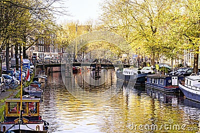 View on the city of Amsterdam, capital of the Netherlands. Canals and canalboats, trees and water Stock Photo