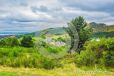 View of the City of Edinburgh famous landmarks Palace, Parliament and Calton Hill. Stock Photo