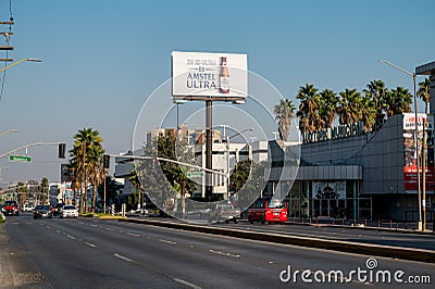View of city street in Tijuana Mexico with billboards and buildings. Editorial Stock Photo