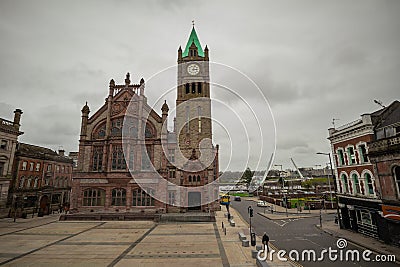 View from the city wall of Derry or Londonderry, place with cannons, overlooking towards the city square with Guildhall and peace Editorial Stock Photo