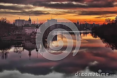View of cityscape in the evening. Church of Blessed Xenia of St. Petersburg left on the riverbank of the river Southern Bug Stock Photo