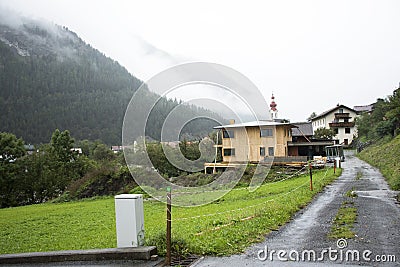 View cityscape and landscape of Pfunds city with Kath Pfarramt church in Tyrol, Austria Stock Photo