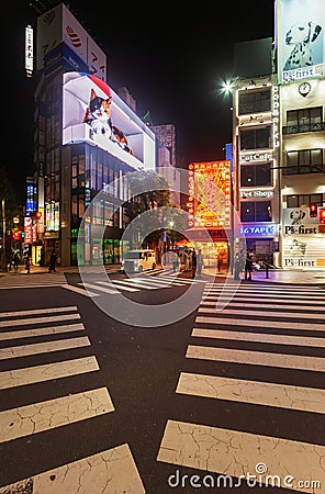 View of cityscape at night with colorful advertisement billboard light beside the street Editorial Stock Photo