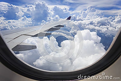 View of cloud with wing of airplane from window Stock Photo
