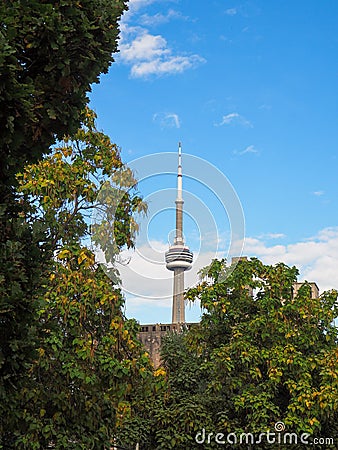 View on the CN Tower with trees on the foreground Editorial Stock Photo