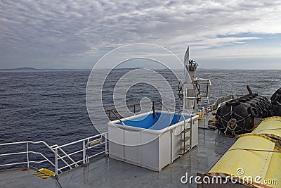 The view of the Coast and islands of Southern Ireland through the mist from the upper deck of a Seismic Vessel Stock Photo