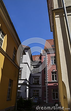 View on the colorful buildings with tiled roof on medieval street in old Riga, Latvia Stock Photo