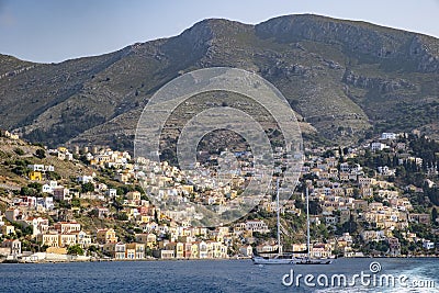 A View of Colorful Houses on the Mountain Side in Symi, Greece Stock Photo