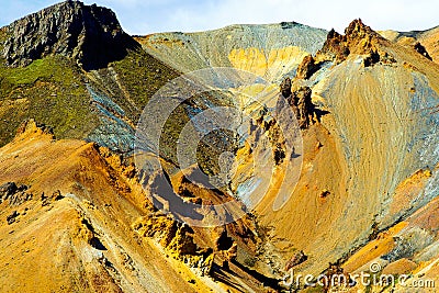 View on colorful yellow reddish rust brown rugged sharp mountain peaks Stock Photo