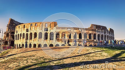 View of the Colosseum adjacent to Via Dei Fori Imperiali on a summer evening Editorial Stock Photo