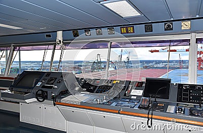 View of the control console on the navigational bridge of the cargo ship. Stock Photo
