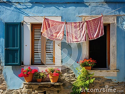 view of the courtyard where the laundry is hung from window to window Stock Photo