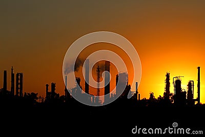 View of crude oil refinery factory during sunset Stock Photo