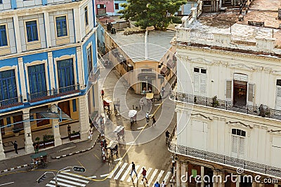 view of Cuban Havana city retro vintage style street and buildings with people in background Editorial Stock Photo