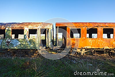 Damaged train wagons in an old abandoned railway network Stock Photo