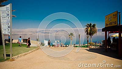 Tourists relaxing and swimming in the water of the Dead Sea in I Editorial Stock Photo