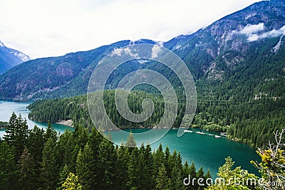 View of Diablo Lake in the North Cascades National Park in Washington State on an overcast summer day Stock Photo