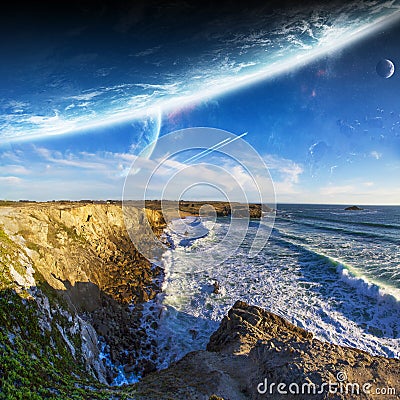 View of distant planet system from cliffs Stock Photo