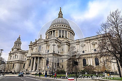 View of the dome of the famous St. Paul's Cathedral in city center on a cloudy day in London, England Editorial Stock Photo