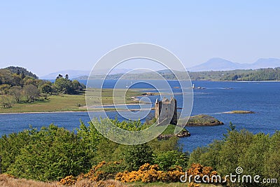 View down Loch Linnhe past Castle Stalker to Mull Stock Photo