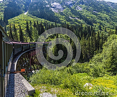 A view down a train crossing a bridge on the White Pass and Yukon railway near Skagway, Alaska Stock Photo