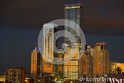 View of the downtown modern buildings, and illuminated skyscrapers at night in Edmonton, Canada Editorial Stock Photo