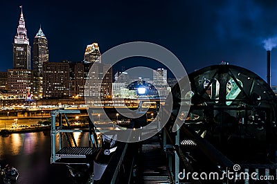 Dramatic Downtown Skyline at Sunset - Abandoned Cuyahoga River Lift Bridge in Cleveland, Ohio Editorial Stock Photo