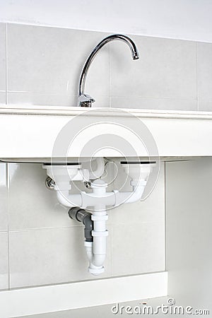 Drain pipes of a kitchen sink after correct installation Stock Photo