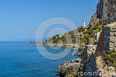 A view eastward down the shore of Cefalu, Sicily towards the lighthouse Stock Photo