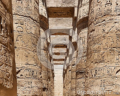 View of Egyptian mythological carvings on the columns of Karnak temple Stock Photo