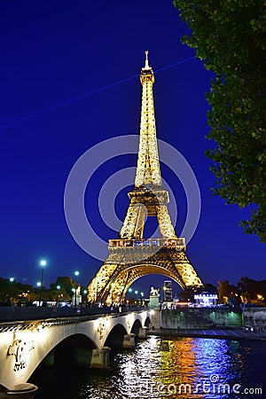 View of the Eiffel Tower at night in Paris Editorial Stock Photo
